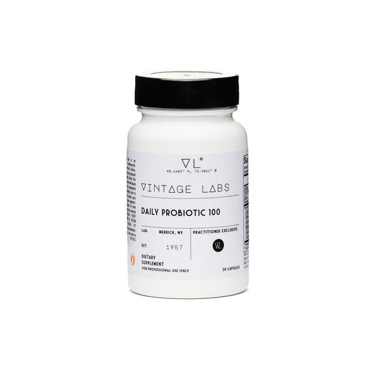 White supplement bottle with black lid on a white background