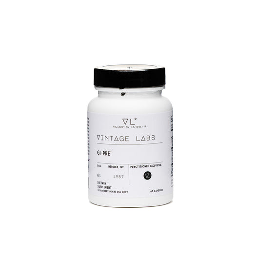 White supplement jar with black lid labeled 'Vintage Labs' on a white background