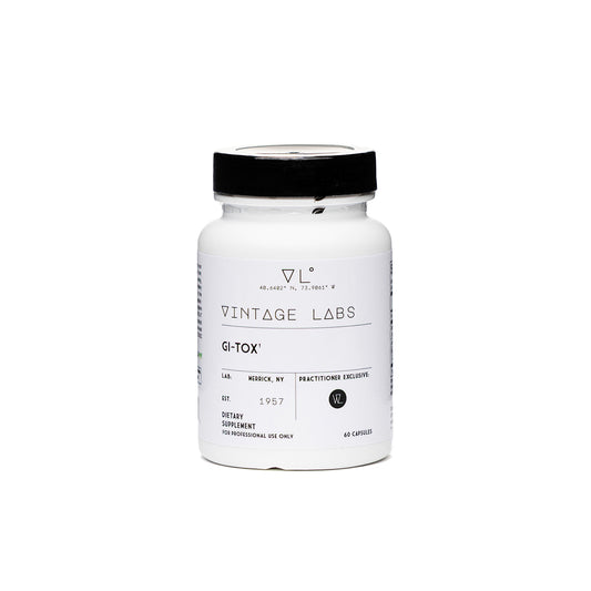 White supplement bottle with black cap labeled 'Vintage Labs' on a white background