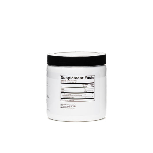 White supplement container with black lid on a white background