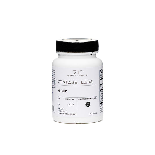 White supplement bottle with black cap labeled 'Vintage Labs' on a white background