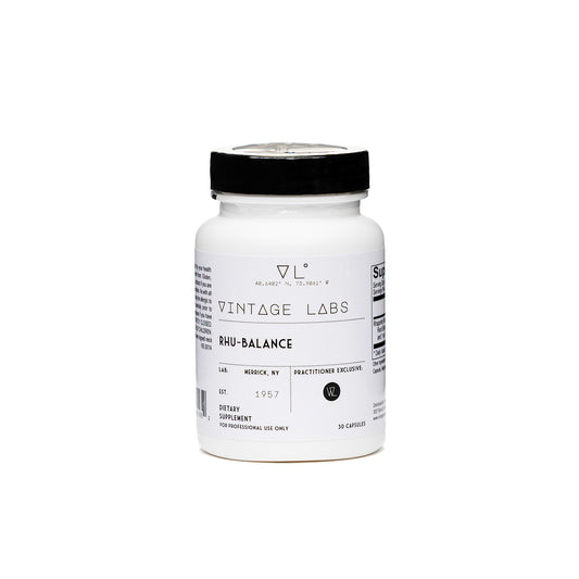 White supplement bottle with black cap labeled 'Vintage Labs' on a white background