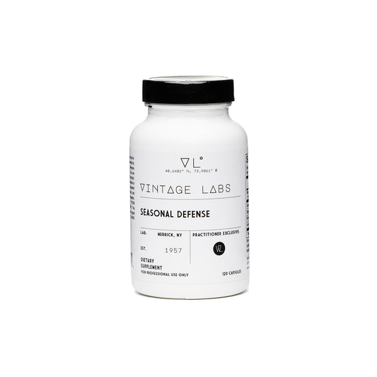 White supplement bottle labeled 'Vintage Labs Seasonal Defense' on a white background