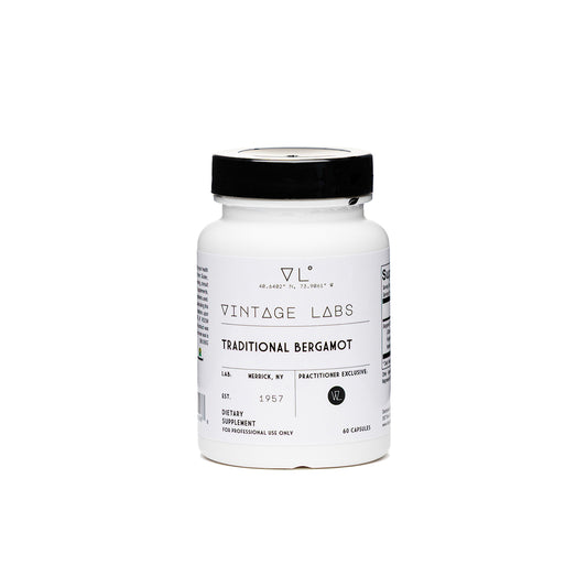 White supplement bottle with black cap labeled 'Vintage Labs' on a white background