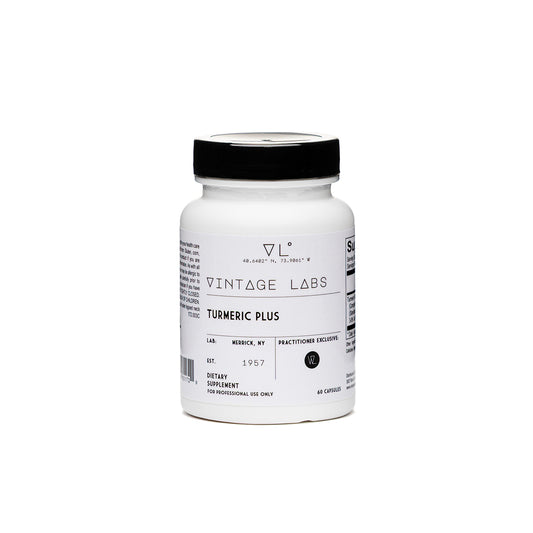 White supplement bottle with black cap labeled 'Vintage Labs Turmeric Plus' on a white background