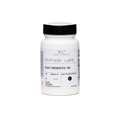 White supplement bottle with black lid on a white background