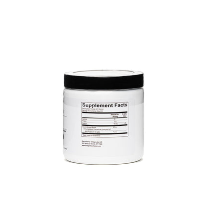 White supplement container with black lid on a white background