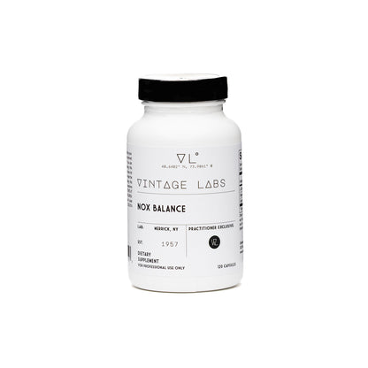 White supplement bottle with black cap on a white background