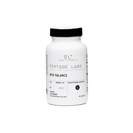 White supplement bottle with black cap on a white background