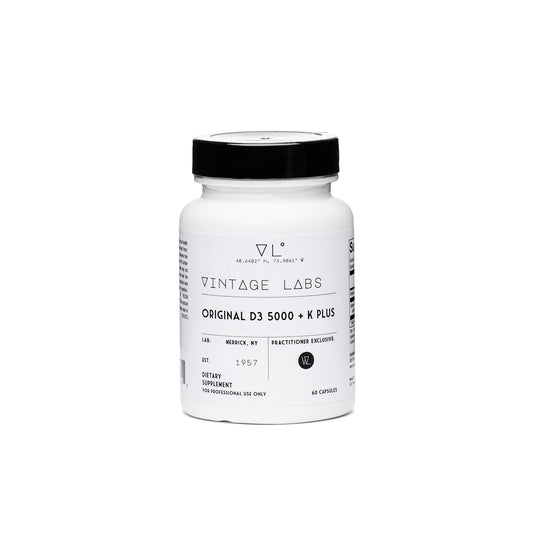 White supplement bottle with black cap labeled 'Vintage Labs' on a white background