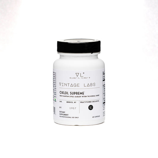 White supplement bottle with black cap labeled 'Vintage Labs' on a white background